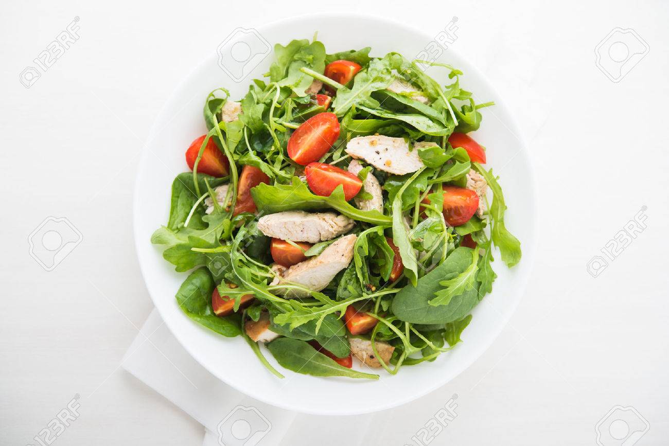 Fresh salad with chicken, tomato and greens (spinach, arugula) top view. Healthy food. - 53193792 Fresh salad with chicken, tomato and greens (spinach, arugula) top view. Healthy food. - 53193792