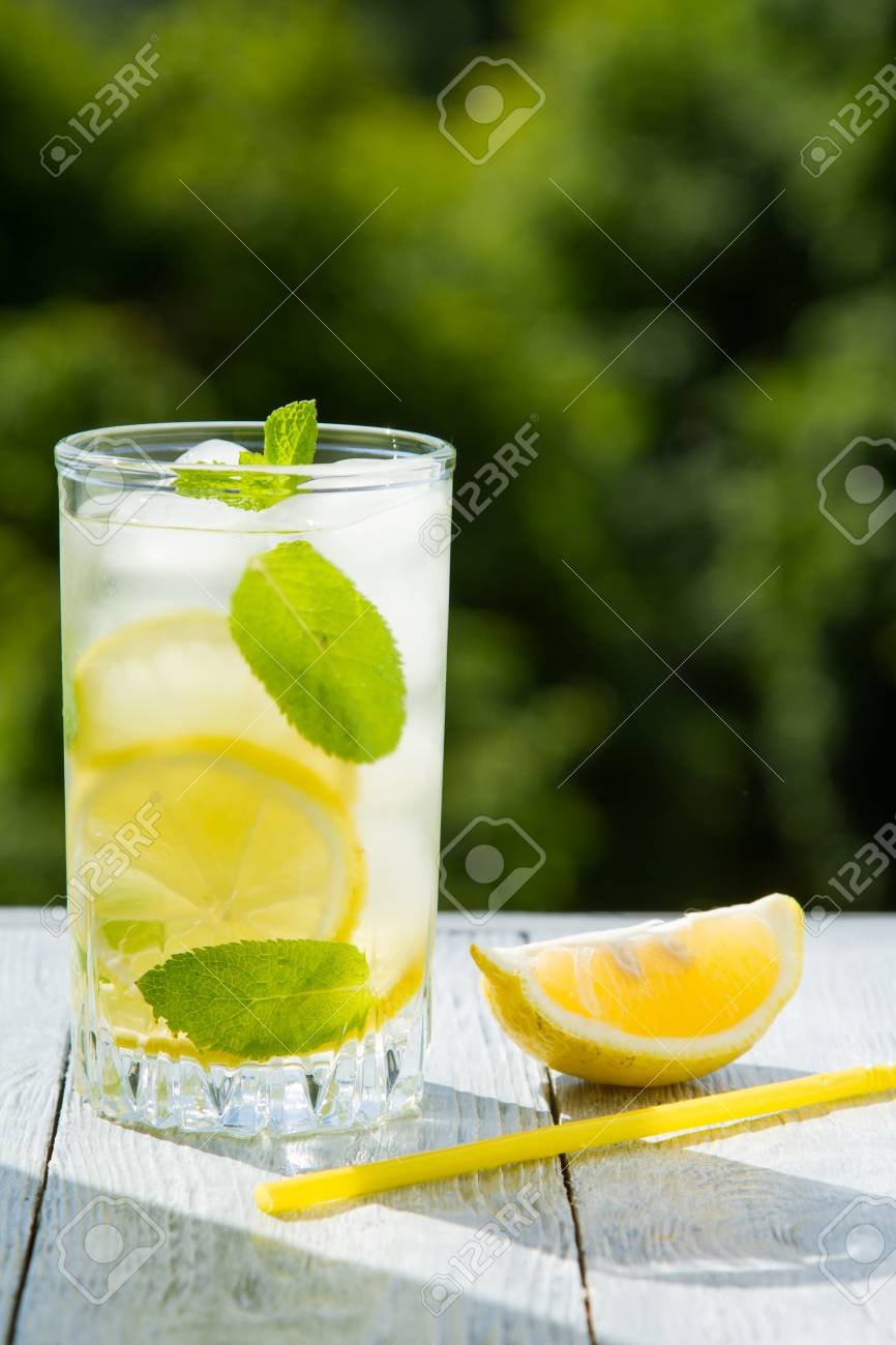 Citrus fresh lemonade in garden setting,summer drink. - 102746782 Citrus fresh lemonade in garden setting,summer drink. - 102746782