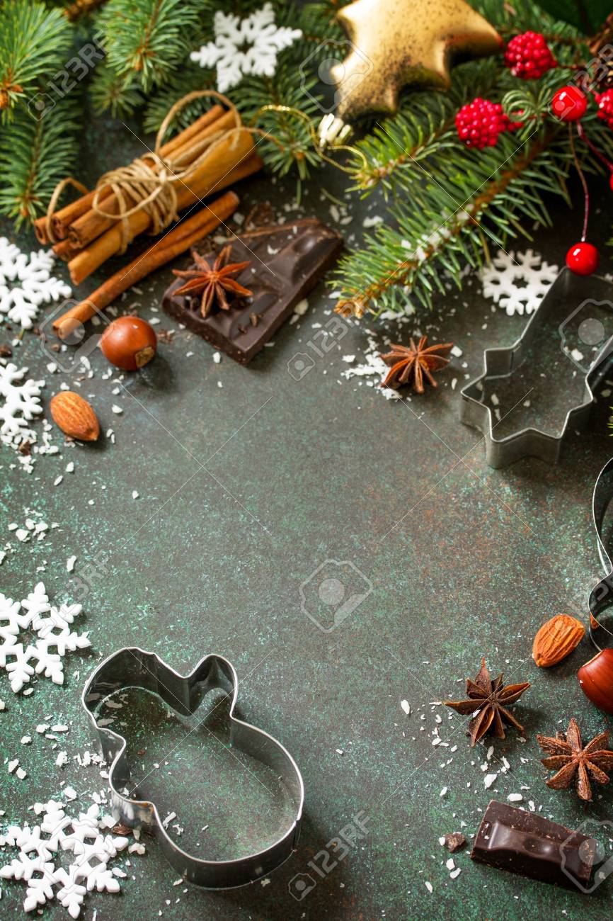 Ingredients for Christmas Gingerbread baking - chocolate, cinnamon, anise and nuts on dark a stone or slate background. Seasonal, food background. Copy space. - 112851433 Ingredients for Christmas Gingerbread baking - chocolate, cinnamon, anise and nuts on dark a stone or slate background. Seasonal, food background. Copy space. - 112851433