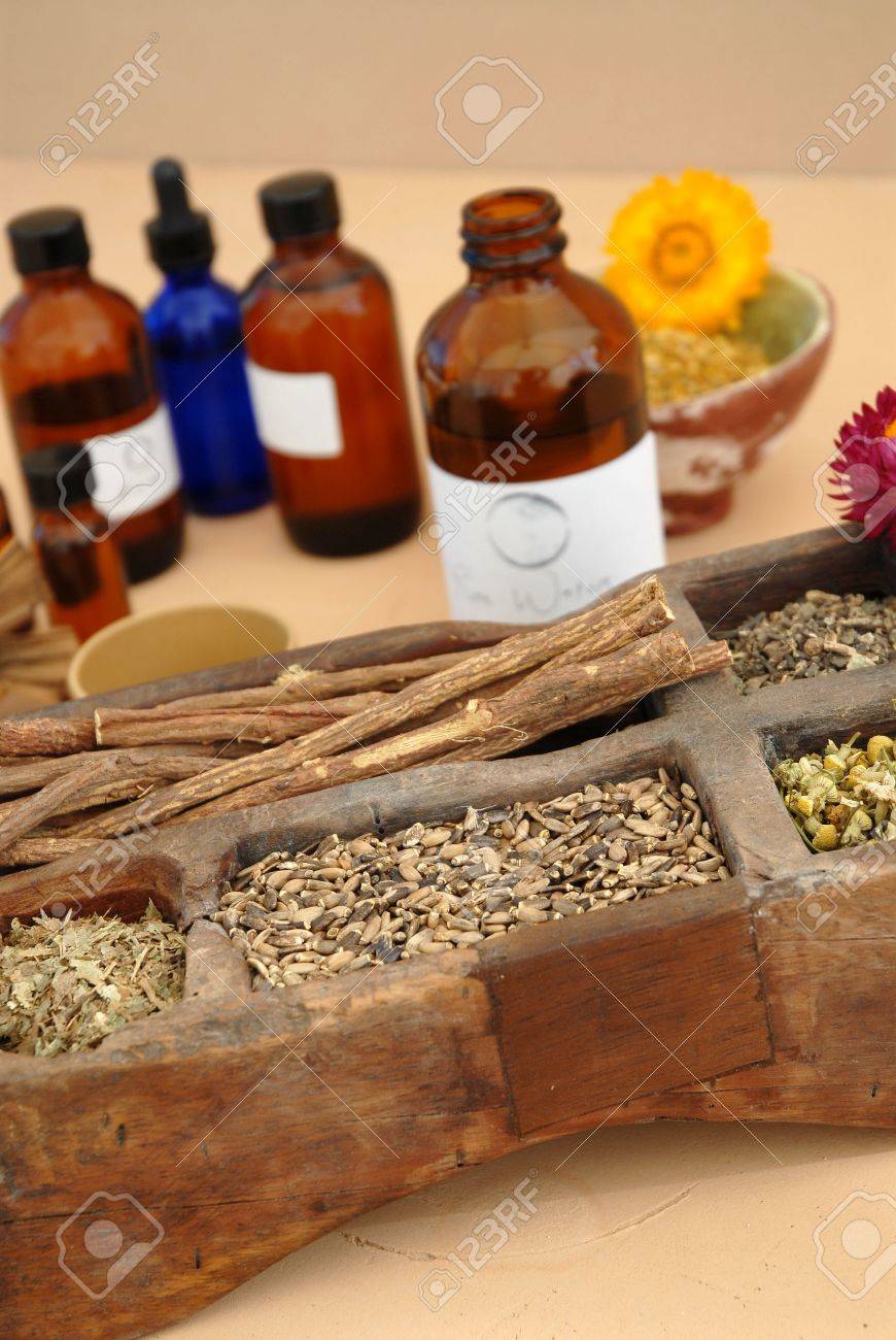 The holistic ingredients of Ayurveda and Herbalism including licorice root, milk thistle seeds, valerian root, chamomile, and tincture bottles. - 916843 The holistic ingredients of Ayurveda and Herbalism including licorice root, milk thistle seeds, valerian root, chamomile, and tincture bottles. - 916843