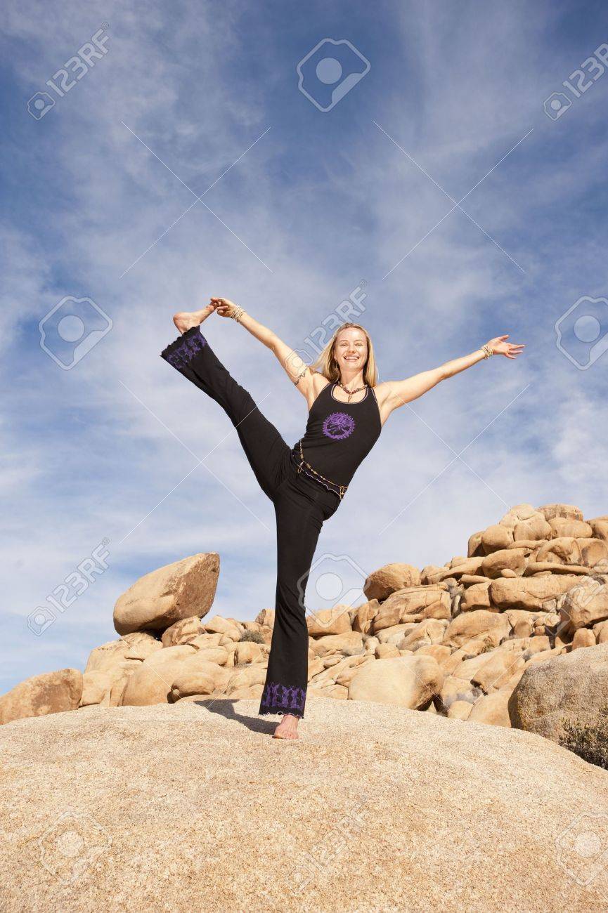 Woman In Powerful Joyful Yoga Pose Outdoors - 