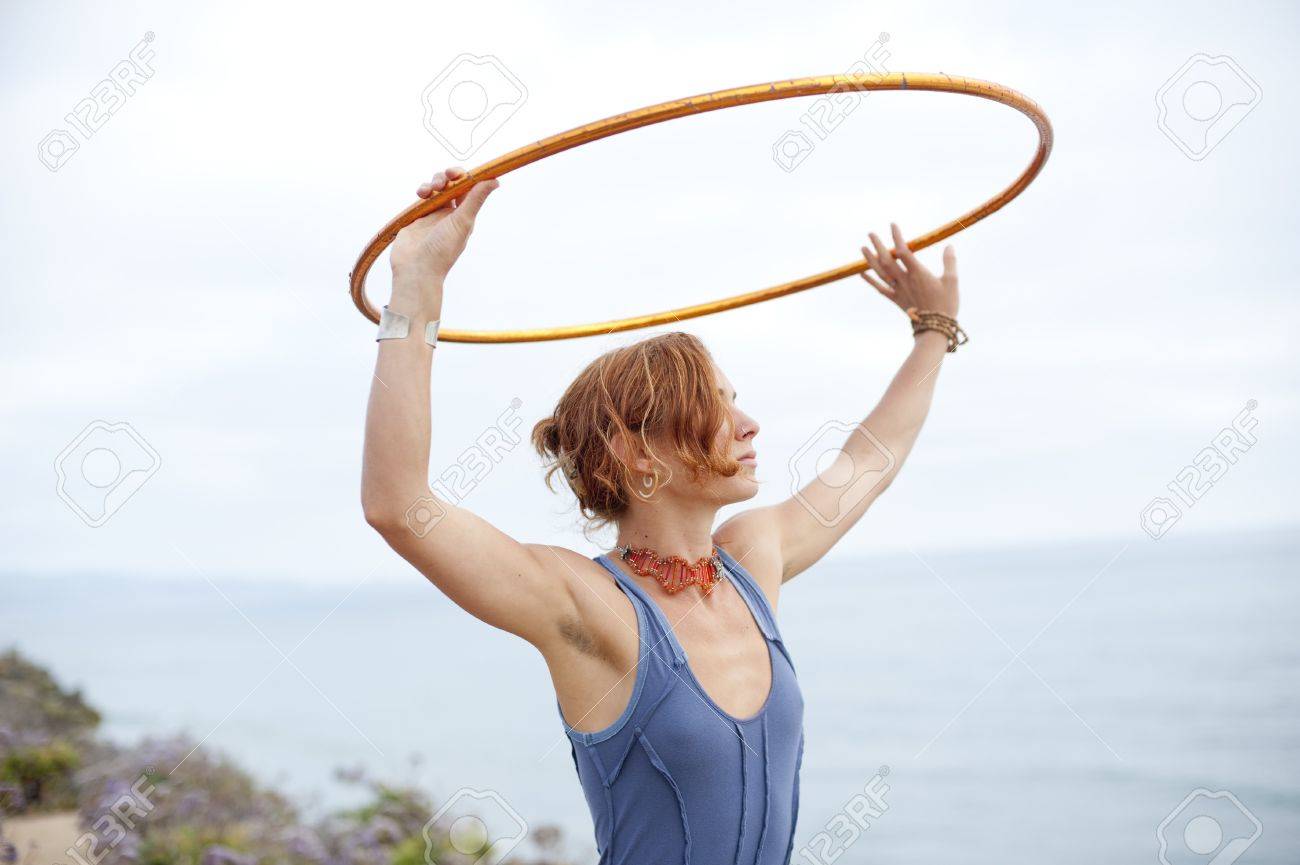 Woman with hoop and the sea and the sky. - 7351744 Woman with hoop and the sea and the sky. - 7351744