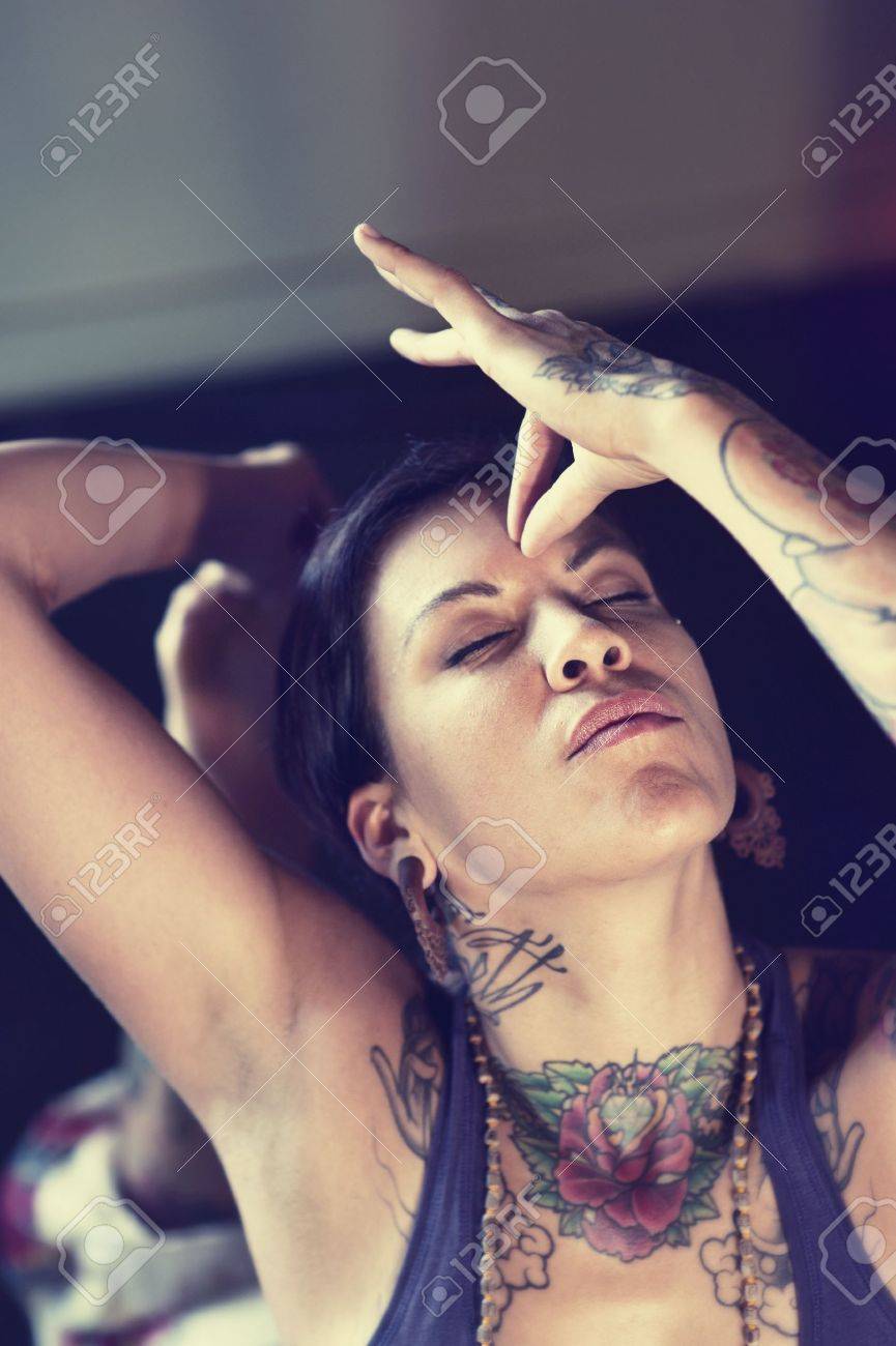 Woman touching her third eye with hand mudra - 17162468 Woman touching her third eye with hand mudra - 17162468