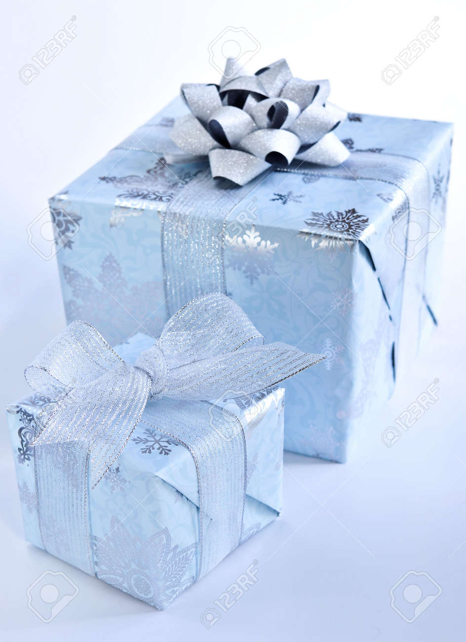 Two Christmas Gift Boxes Wrapped In Blue Paper With Silver Ribbon Stock  Photo, Picture and Royalty Free Image. Image 3786892.