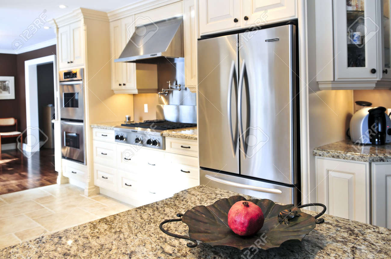 interior of modern luxury kitchen with stainless steel appliances