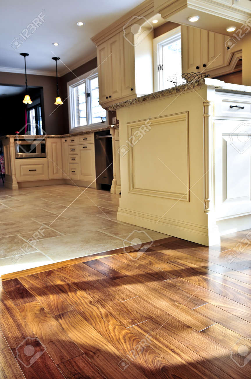 Hardwood And Tile Floor In Residential Home Kitchen And Dining