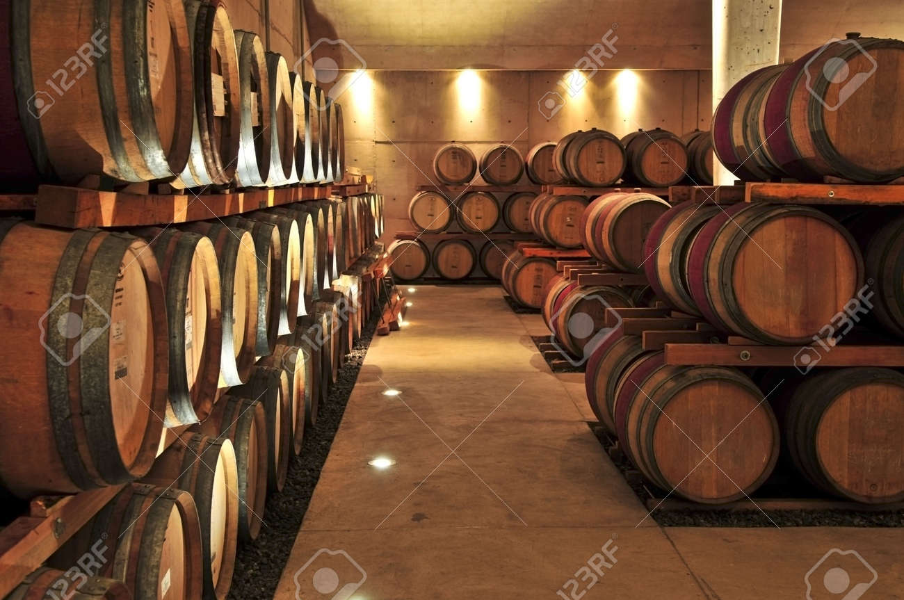 oak wine barrels. stacked oak wine barrels in winery cellar stock photo 4616873 n