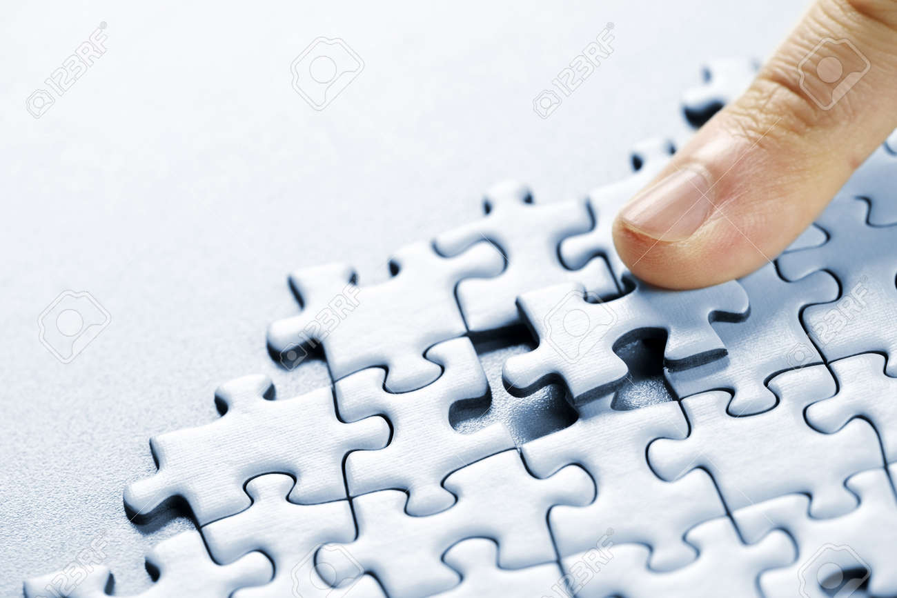 finger pushing missing puzzle