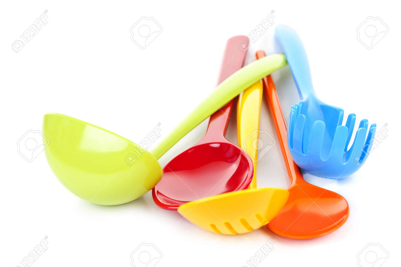 White Kitchen Utensils various colorful plastic kitchen utensils on white background White Kitchen Utensils various colorful plastic kitchen utensils on white background