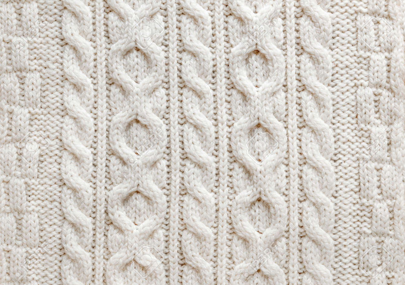 Knit texture of light natural wool knitted fabric with cable pattern as background - 30610296 Knit texture of light natural wool knitted fabric with cable pattern as background - 30610296