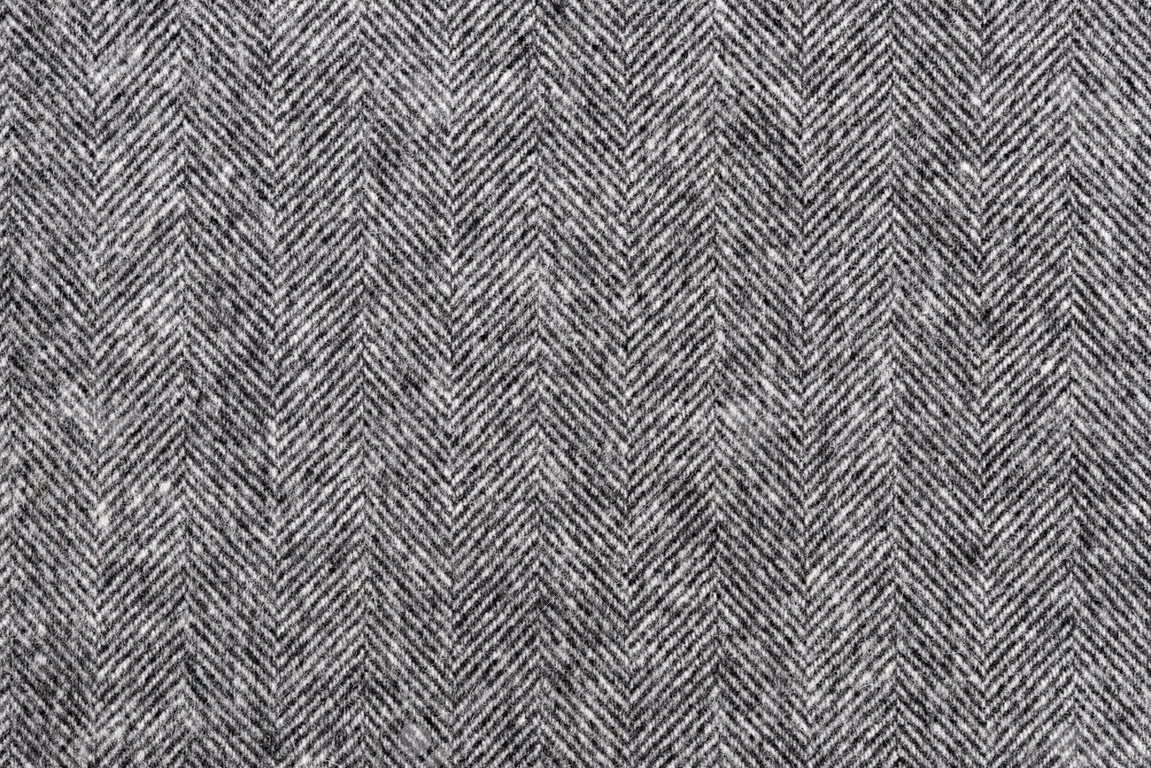 Herringbone tweed background with closeup on wool fabric texture - 45327253 Herringbone tweed background with closeup on wool fabric texture - 45327253