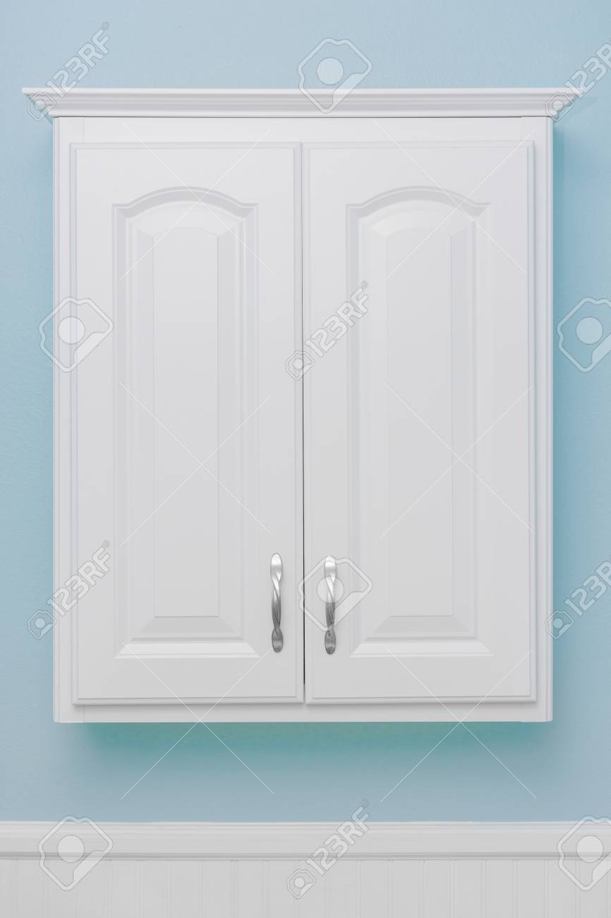 Clean White Storage Cabinet Floating Mount Light Blue Wall Stock Photo Picture And Royalty Free Image Image 104246917