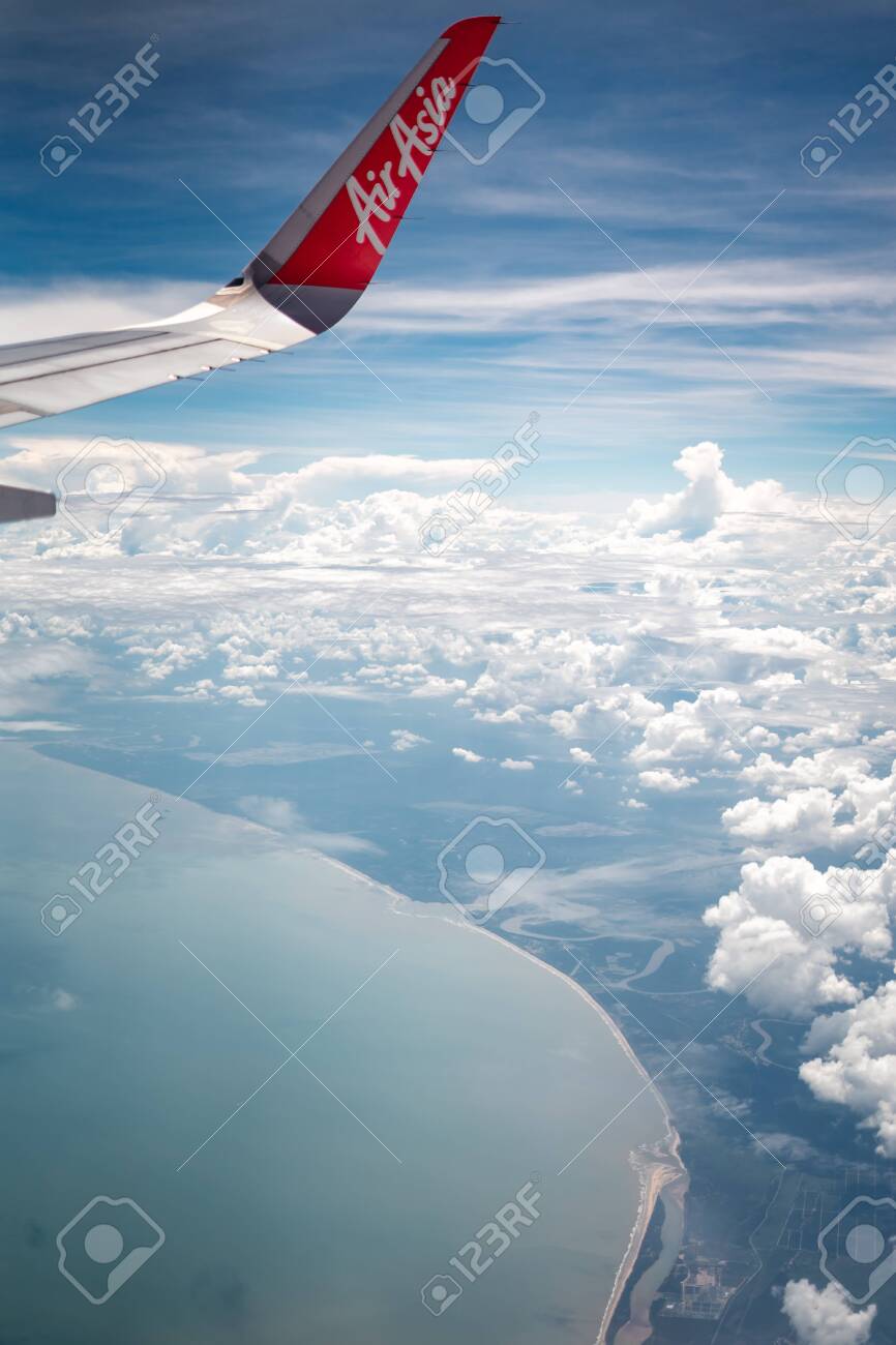 Tawau Malaysia Nov 24 2019 Air Asia Aircraft Wing Flying Over Clouds On A Sunny Day Stock Photo Picture And Royalty Free Image Image 136135196