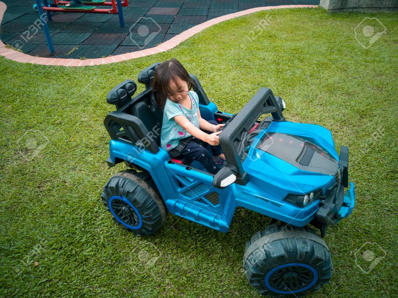 kids driving toy cars