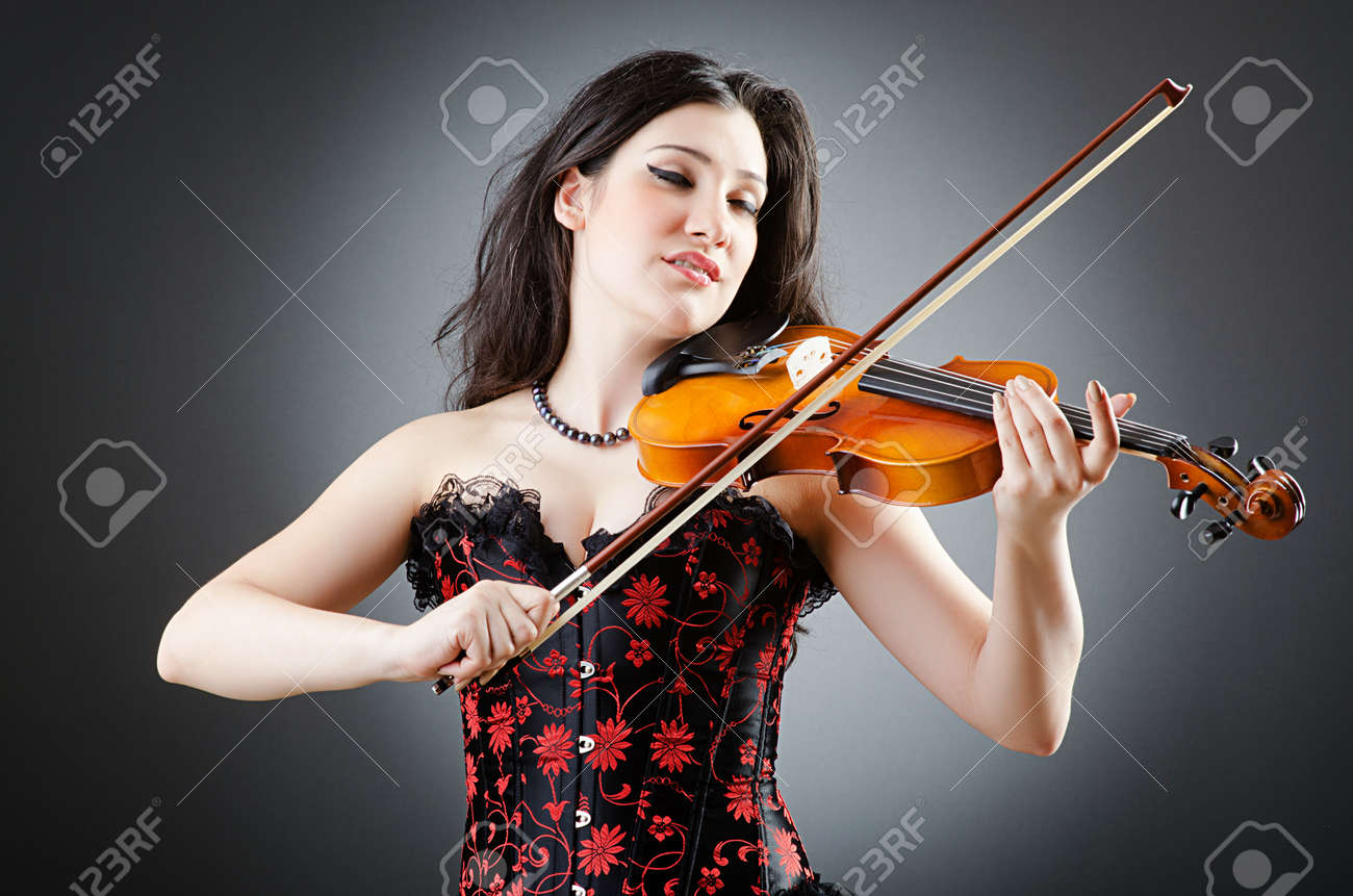 Female Violin Player Against Background Stock Photo, Picture and Royalty  Free Image. Image 14336570., image size:1300x861