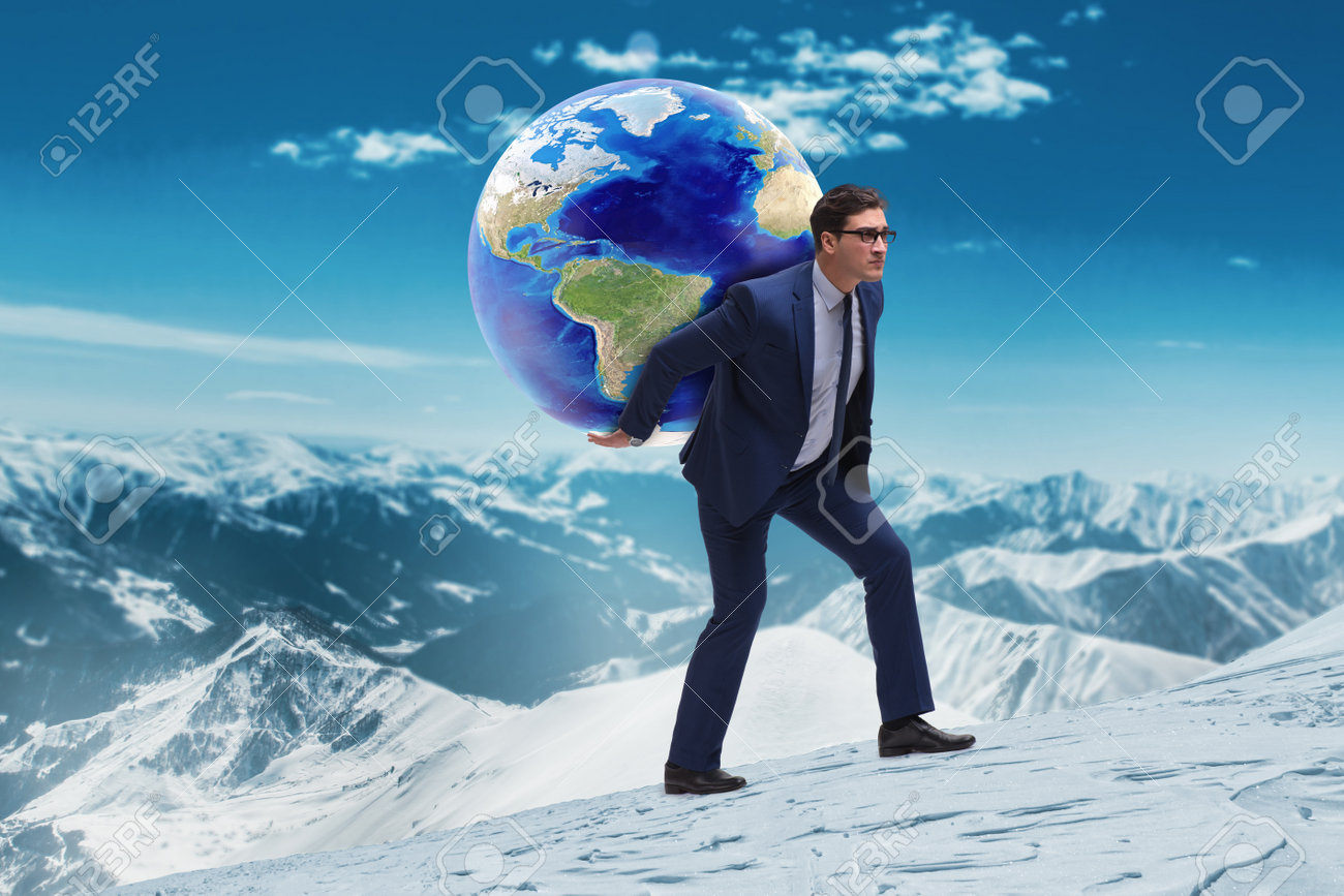 businessman carrying earth on his shoulders stock photo picture and