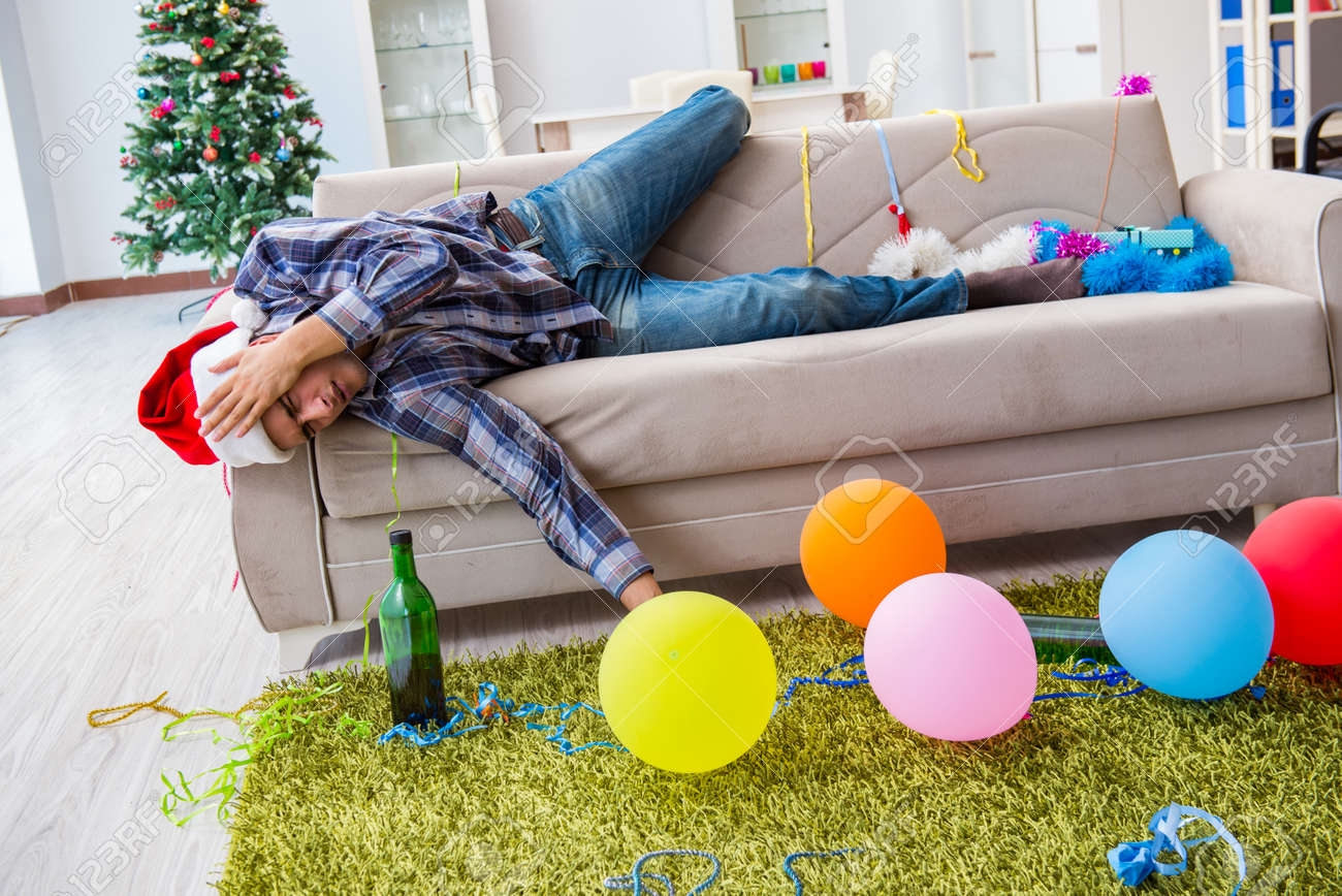 man having hangover after christmas party stock photo picture and christmas hangover