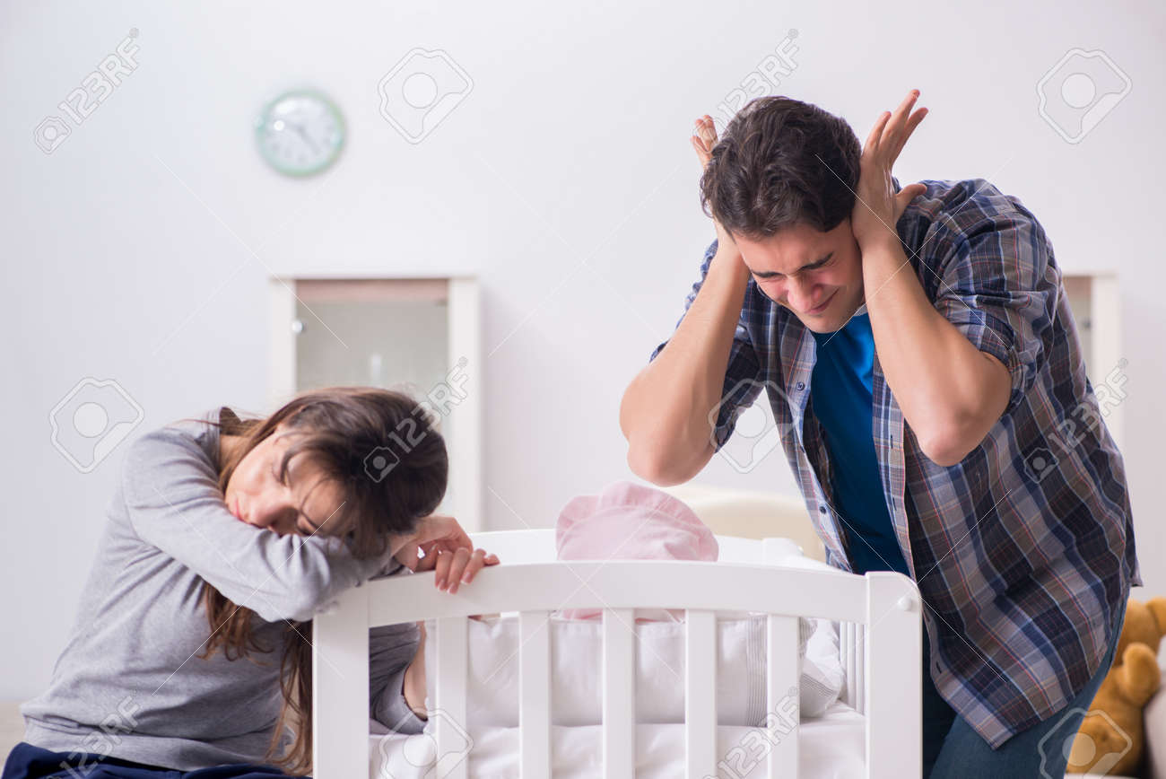 Young dad cannot stand baby crying - 94781466 Young dad cannot stand baby crying - 94781466