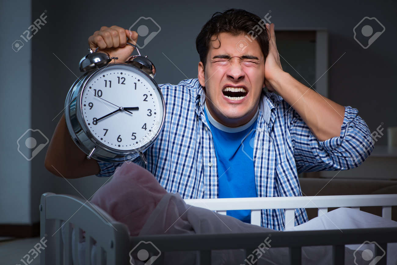 Young Father Under Stress Due To Baby Crying At Night Stock Photo Picture And Royalty Free Image Image 95224211