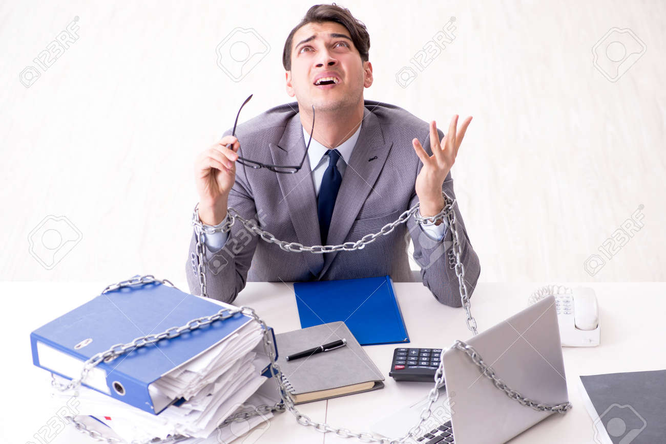 busy employee chained to