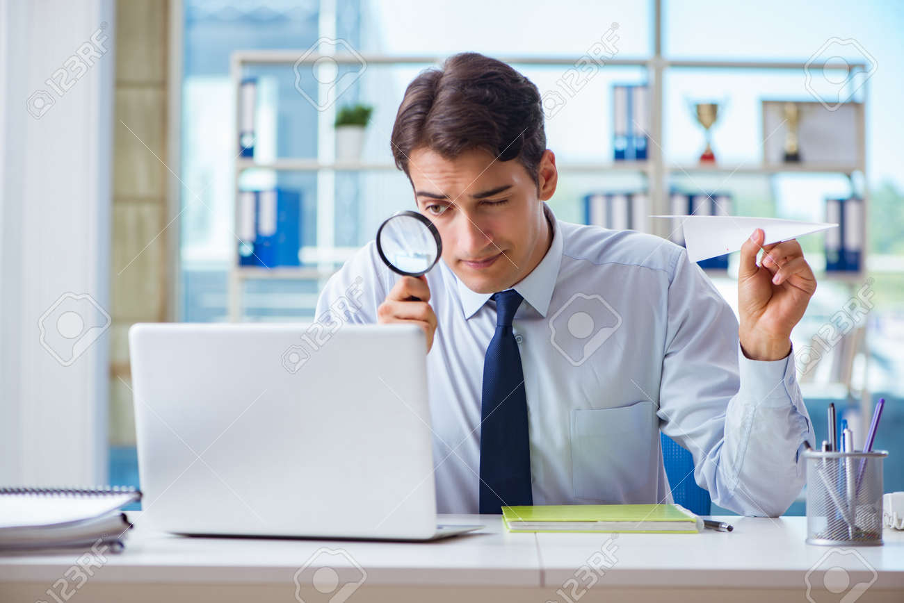 Businessman with magnifying glass and paper plane - 106387018 Businessman with magnifying glass and paper plane - 106387018