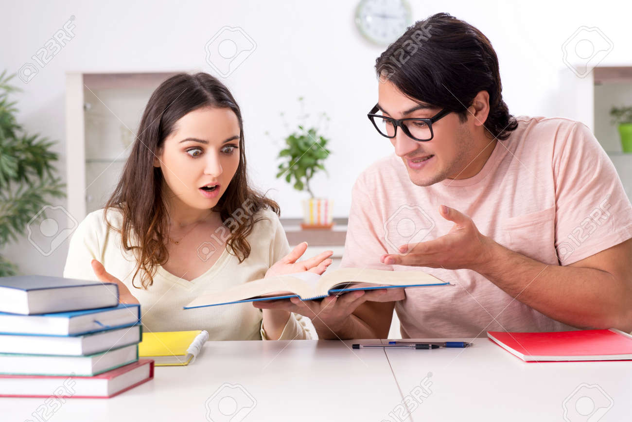 Students preparing for exam together at home - 120837891 Students preparing for exam together at home - 120837891