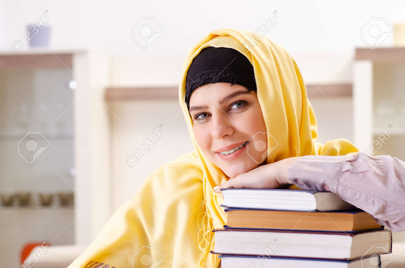 Female student in hijab preparing for exams - 123667075 Female student in hijab preparing for exams - 123667075