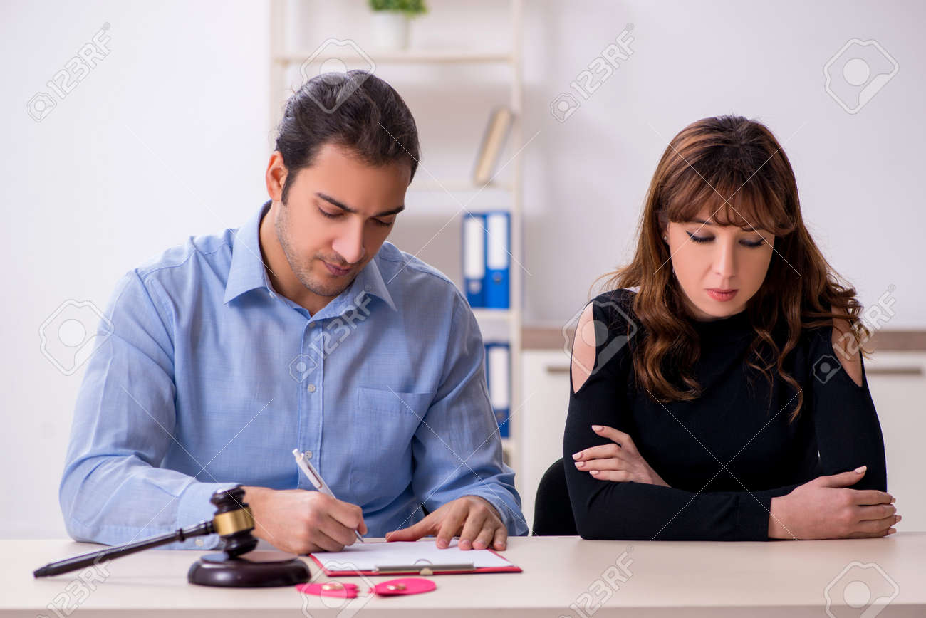 Young pair in courthouse in divorcing concept - 153152026 Young pair in courthouse in divorcing concept - 153152026