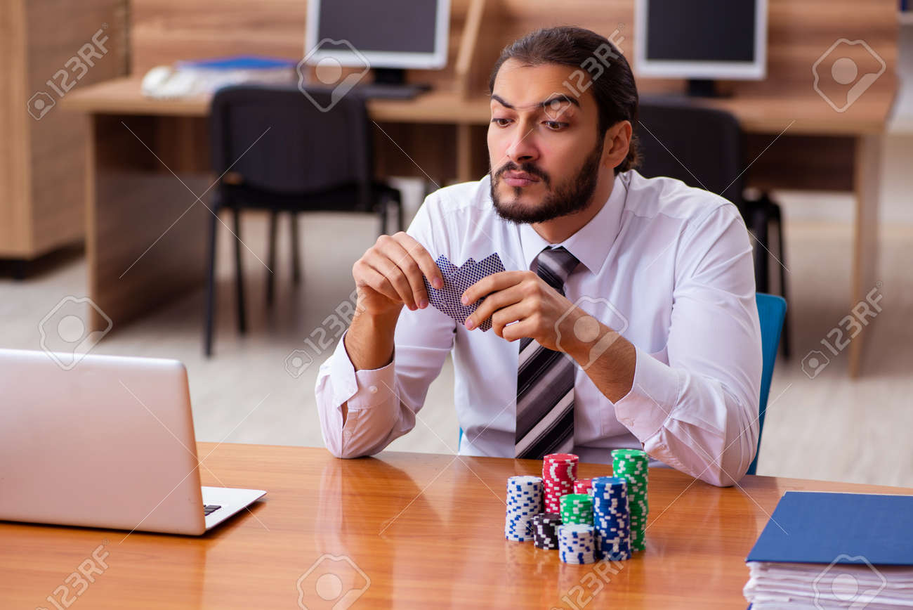 Young male employee in gambling concept - 168015037 Young male employee in gambling concept - 168015037
