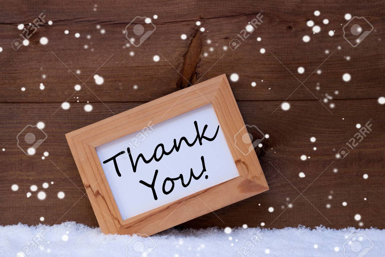 雪の結晶の白い雪のフォト フレームとブラウンのクリスマス カード 英語のテキストありがとうございます 素朴な木製 レトロなビンテージ背景 の写真素材 画像素材 Image