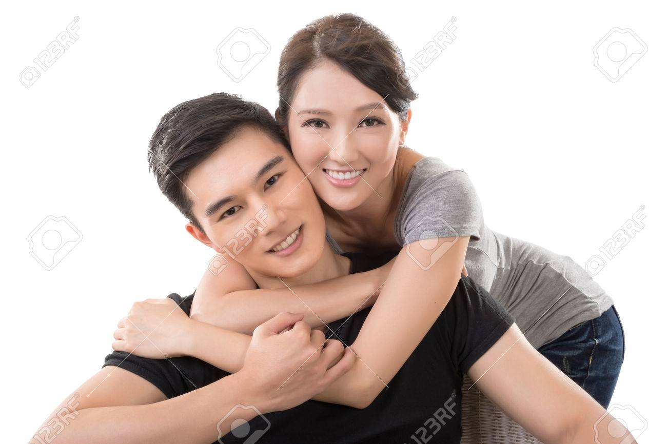 attractive young asian couple closeup portrait on white stock