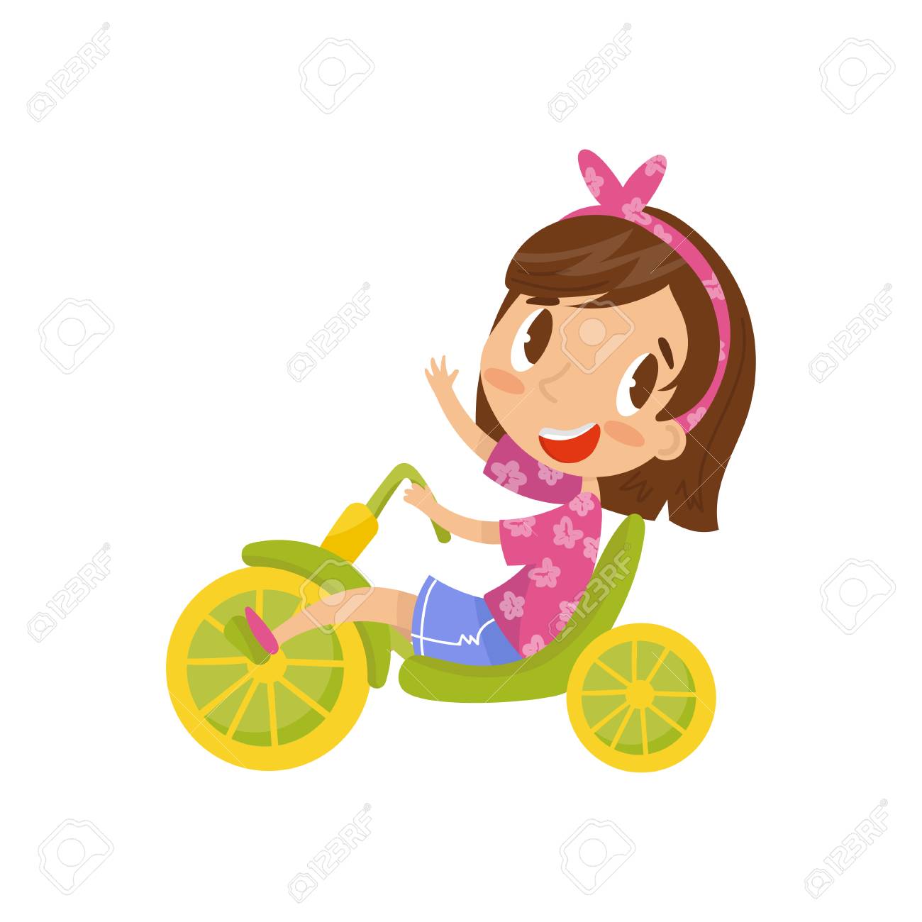 girl riding tricycle