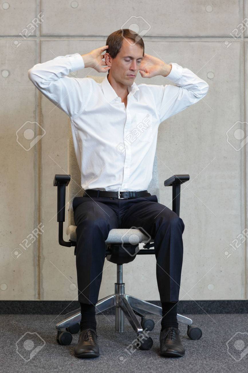 business man exercising on chair - office occupational disease prevention - 33437998 business man exercising on chair - office occupational disease prevention - 33437998