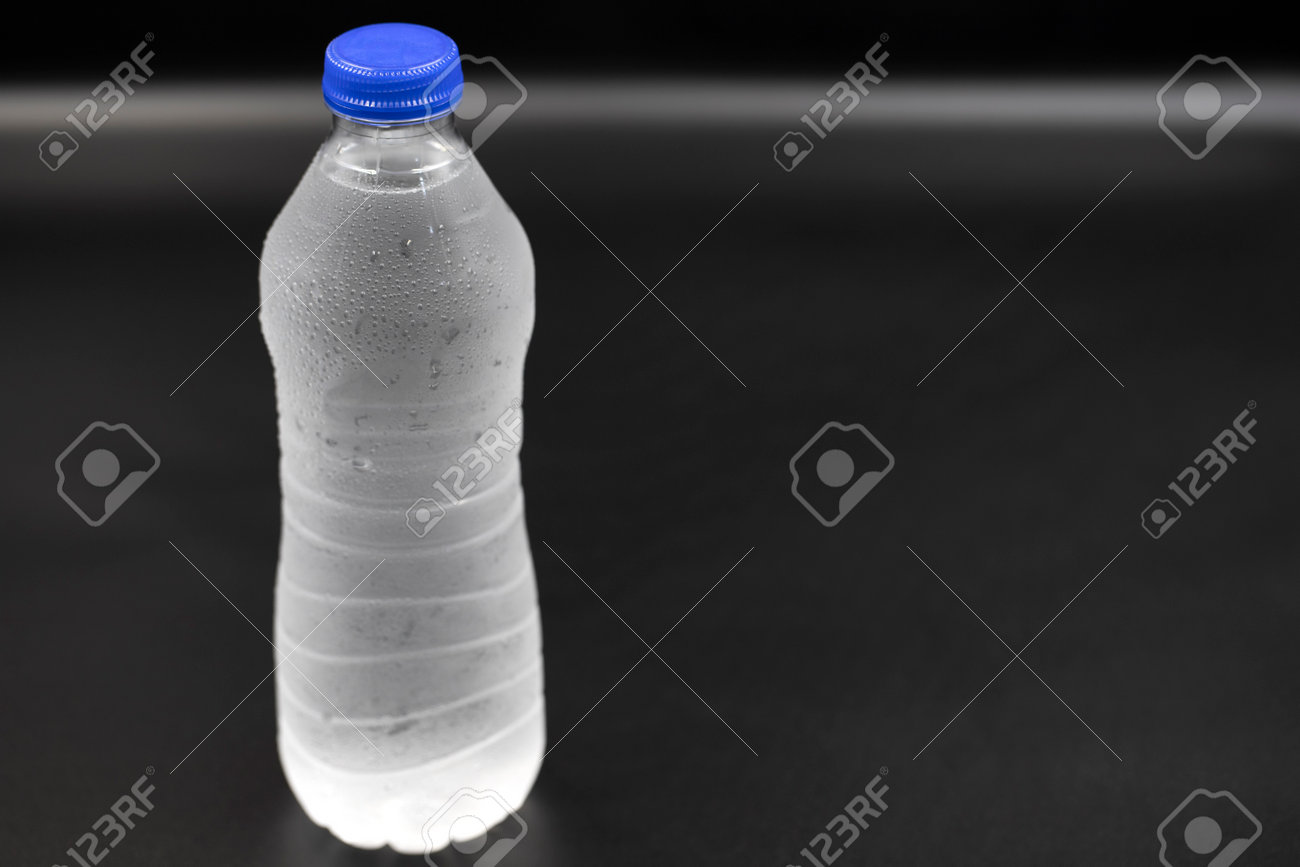 https://previews.123rf.com/images/enezselvi/enezselvi2302/enezselvi230204877/197966179-pet-bottle-filled-with-water-on-a-black-background-close-up-horizontal-view.jpg