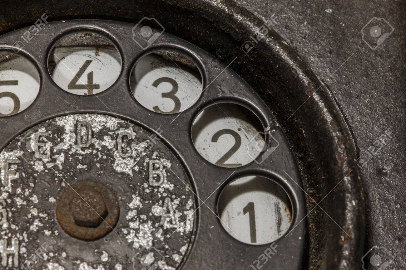 Old black telephone. Close-up of a rotary dial - 30457488 Old black telephone. Close-up of a rotary dial - 30457488