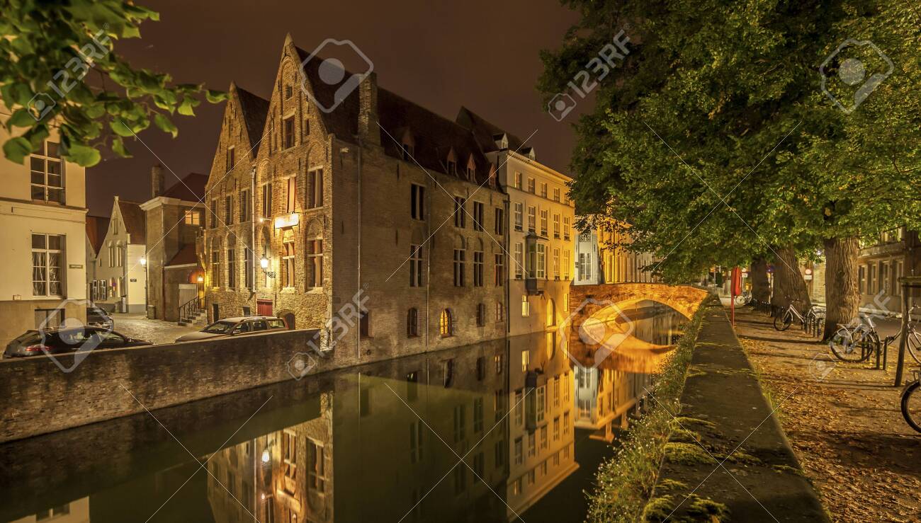 Romantic nocturnal view of a canal in Bruges. Night view of famous Bruges city view, Belgium, nightshot of Bruges canals, houses on canal - 131748616 Romantic nocturnal view of a canal in Bruges. Night view of famous Bruges city view, Belgium, nightshot of Bruges canals, houses on canal - 131748616