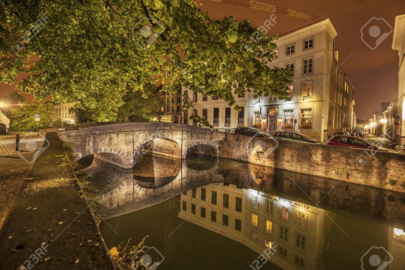 Romantic nocturnal view of a canal in Bruges. Night view of famous Bruges city view, Belgium, nightshot of Bruges canals, houses on canal - 131748915 Romantic nocturnal view of a canal in Bruges. Night view of famous Bruges city view, Belgium, nightshot of Bruges canals, houses on canal - 131748915