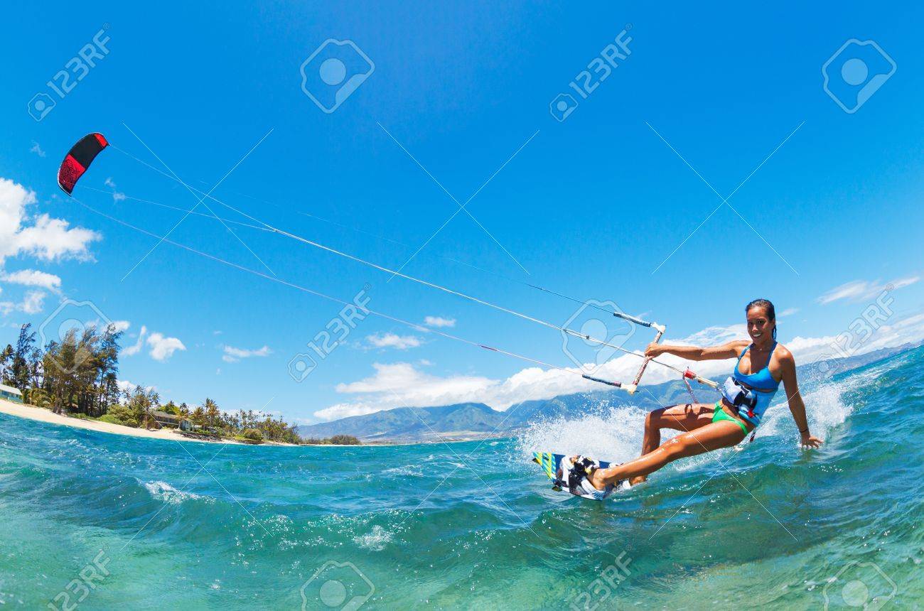 Attractive Young Woman KiteBoarding, Fun in the ocean, Extreme Sport Kitesurfing - 22168486 Attractive Young Woman KiteBoarding, Fun in the ocean, Extreme Sport Kitesurfing - 22168486