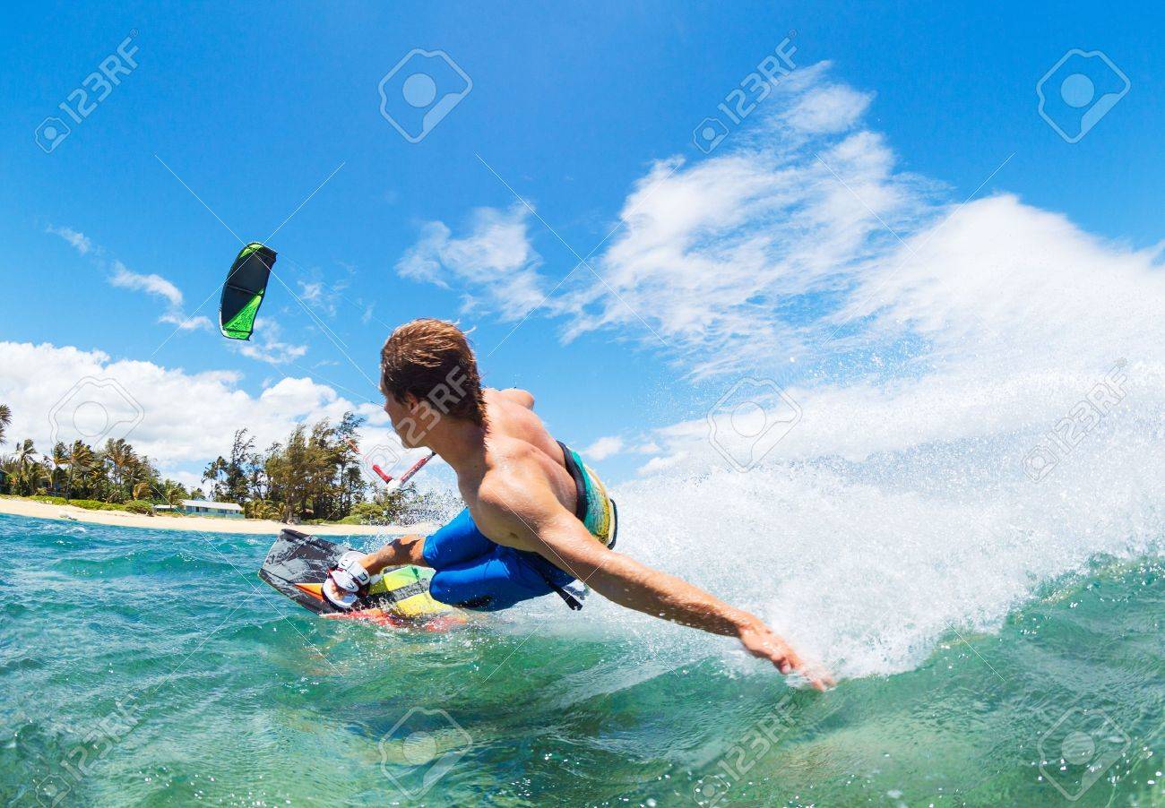 Young Man KiteBoarding, Fun in the ocean, Extreme Sport Kitesurfing - 22168497 Young Man KiteBoarding, Fun in the ocean, Extreme Sport Kitesurfing - 22168497