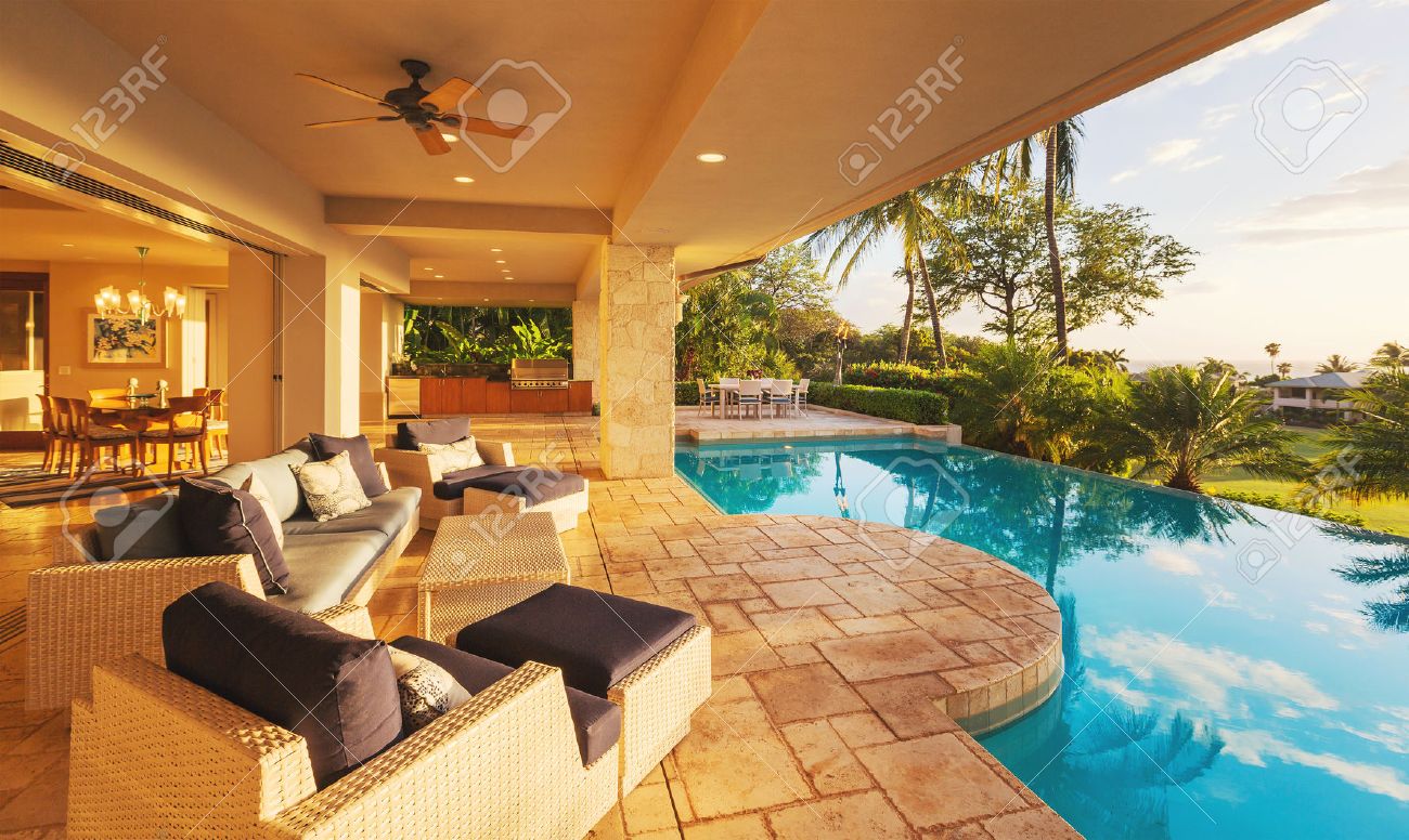 Luxury House Pool beautiful luxury home with swimming pool at sunset stock photo Luxury House Pool beautiful luxury home with swimming pool at sunset stock photo