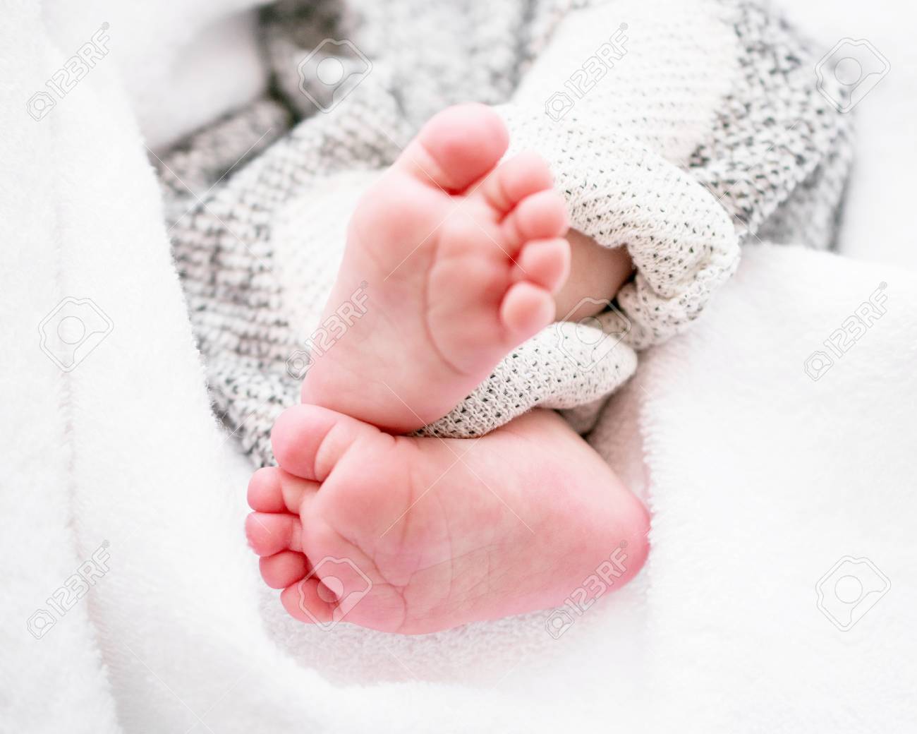 closeup of newborn baby feet template for baby book or baby stock