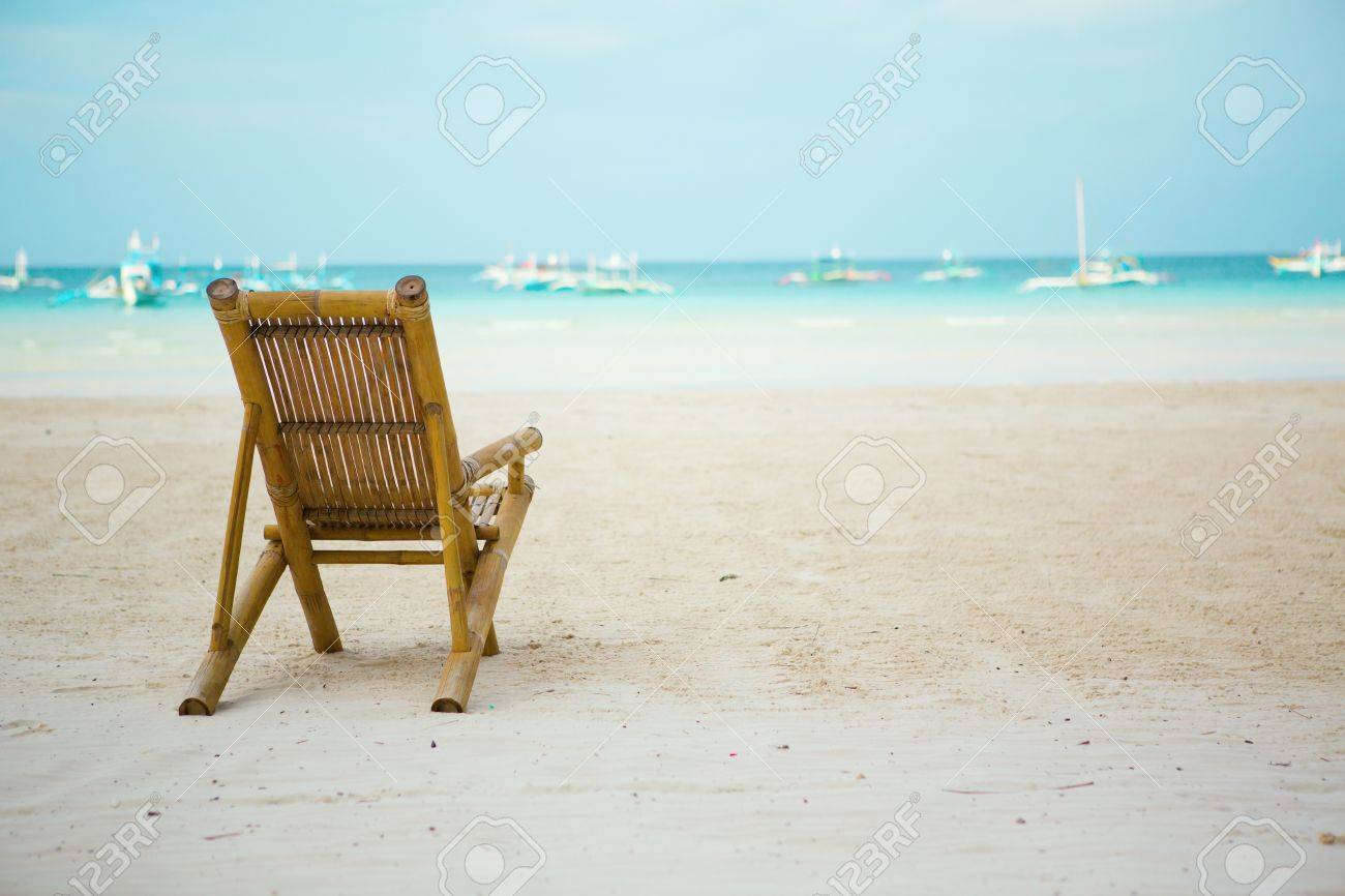 beach chair on perfect tropical white sand beach with turquoise