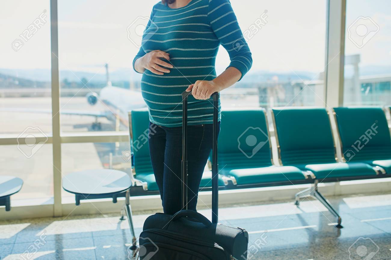 Pregnant Woman At Second Trimester Traveling By Plane Mother Stock Photo Picture And Royalty Free Image Image 99609790