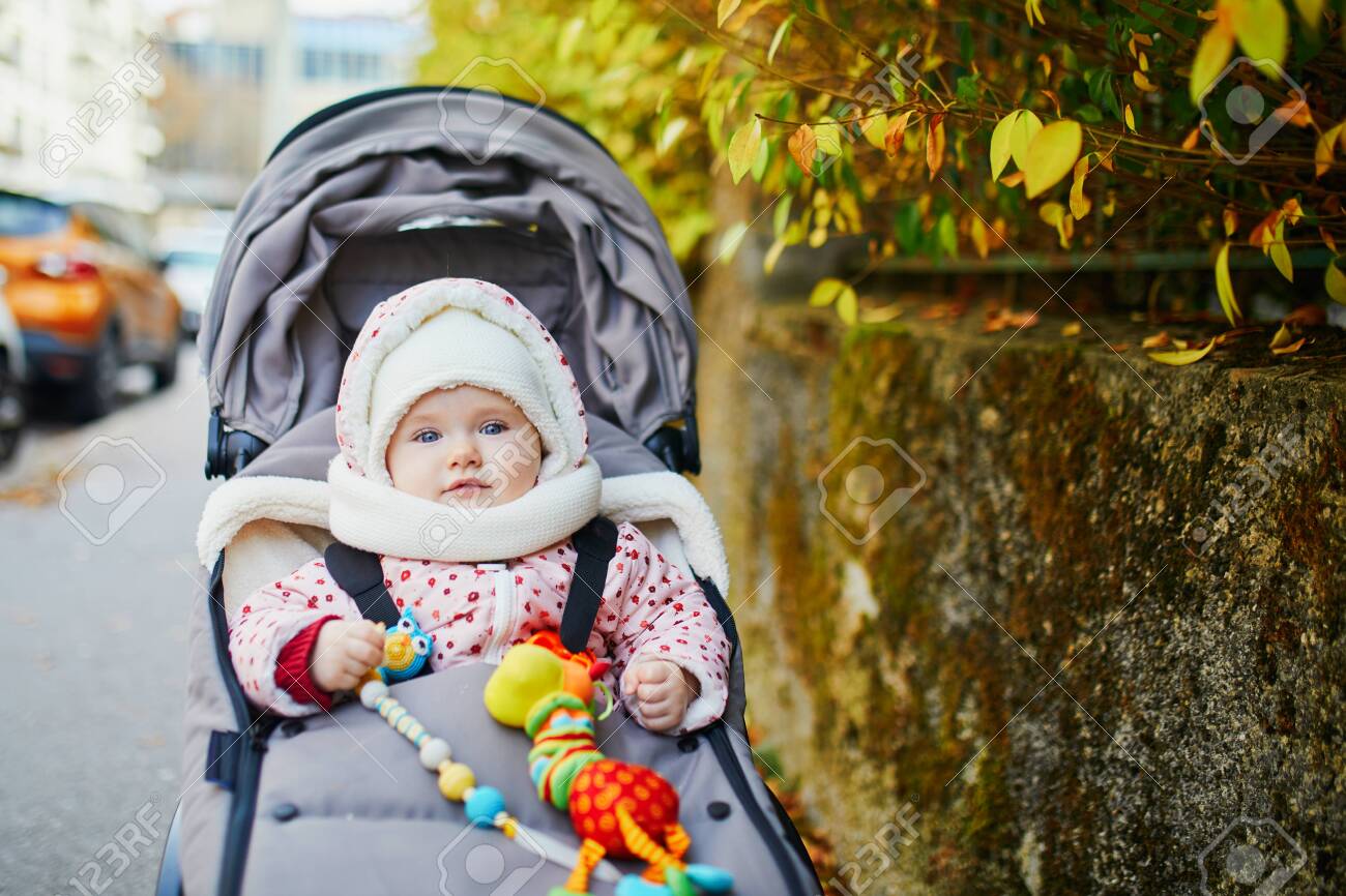 Happy Little Child Baby Girl In Stroller With Colorful Autumn Stock Photo Picture And Royalty Free Image Image 124575379