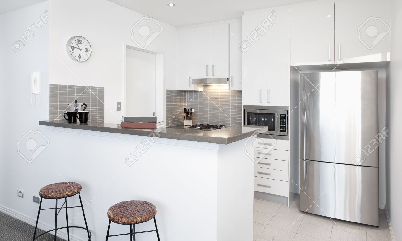 Uncategorized White Kitchen Stainless Steel Appliances modern white kitchen in apartment with polished stainless steel appliances stock photo 11800523