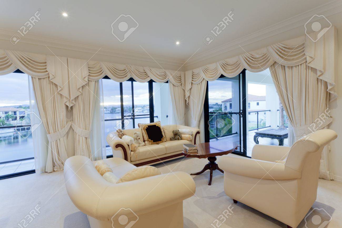stylish living room with view of waterfront houses stock photo stylish living room with view of waterfront houses stock photo