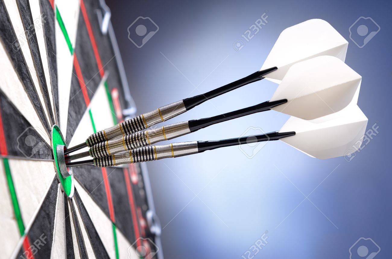 three darts in bullseye of dartboard stock photo picture and