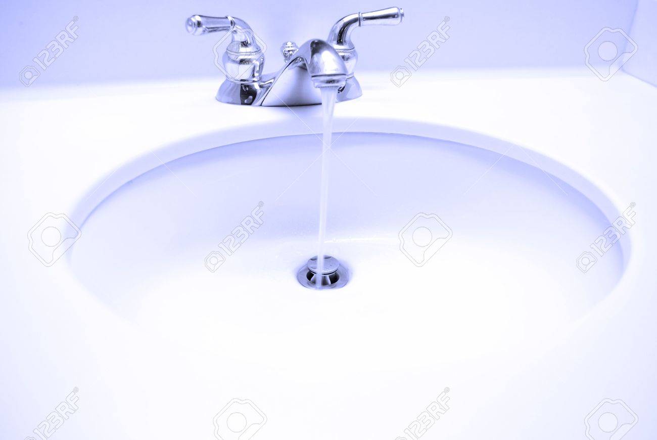 Bathroom Sink With Water Running Stock Photo