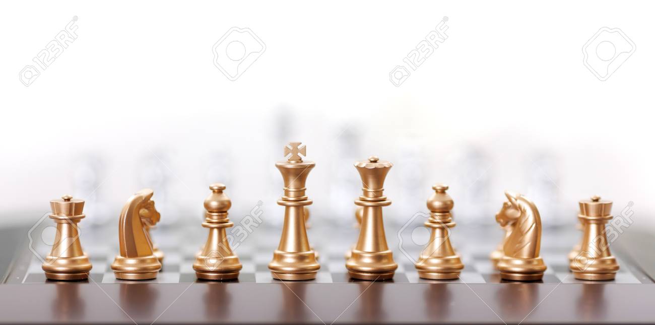 golden chess pieces in starting position stock photo picture and