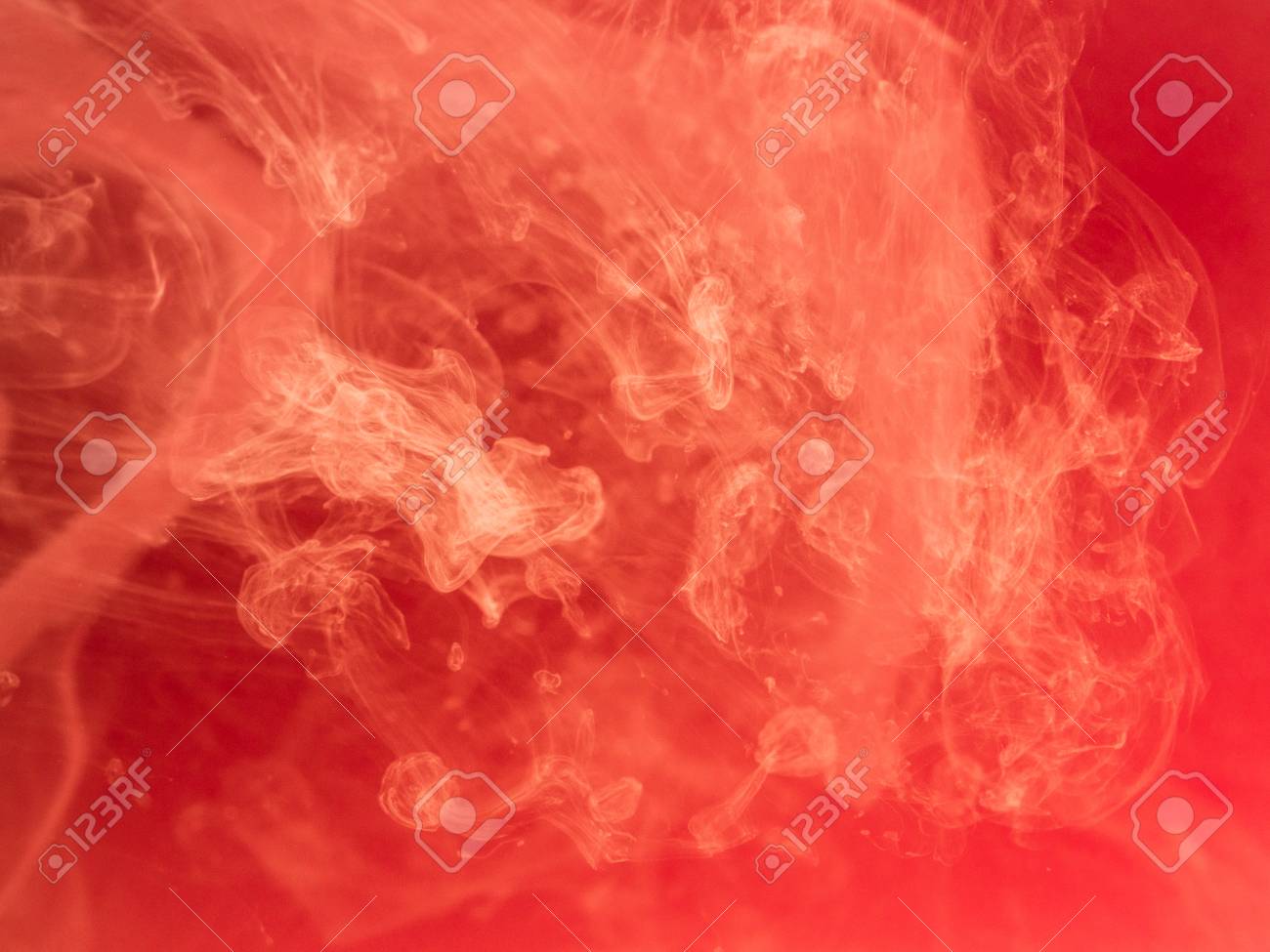 abstract red background ink smoke in water the patterns of stock